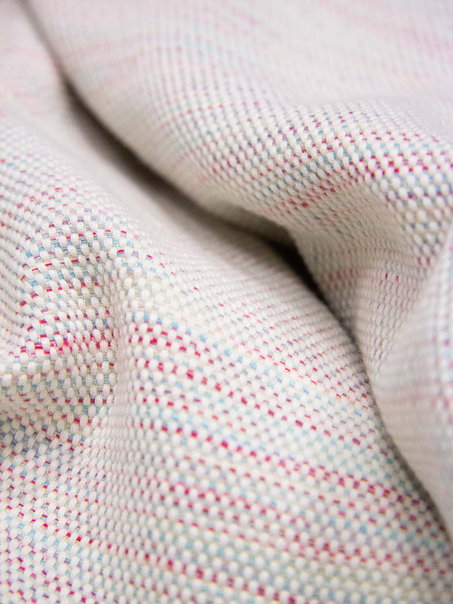 pink patterned lightweight beach towel close up