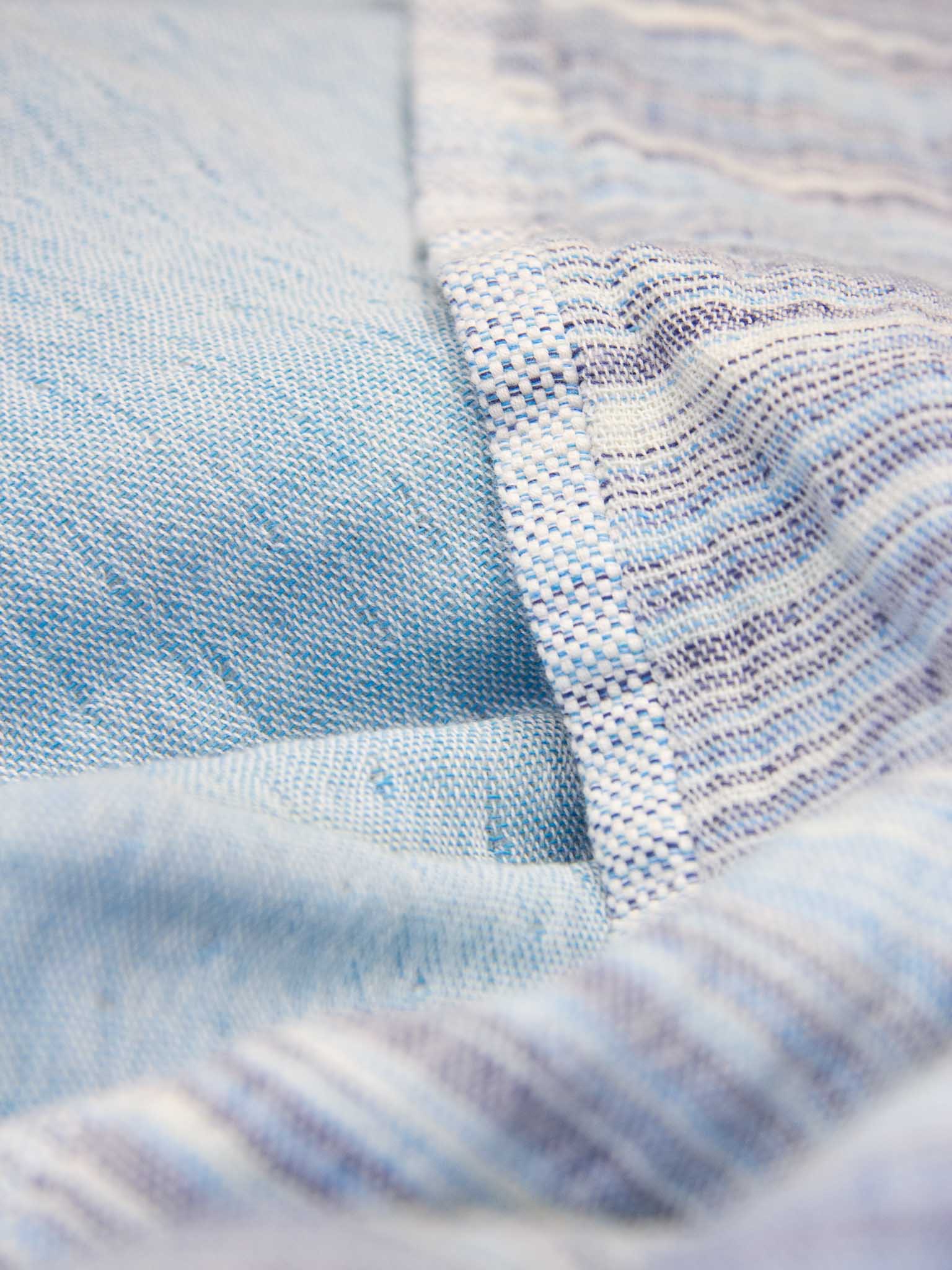 Blue patterned double sided beach towel close up