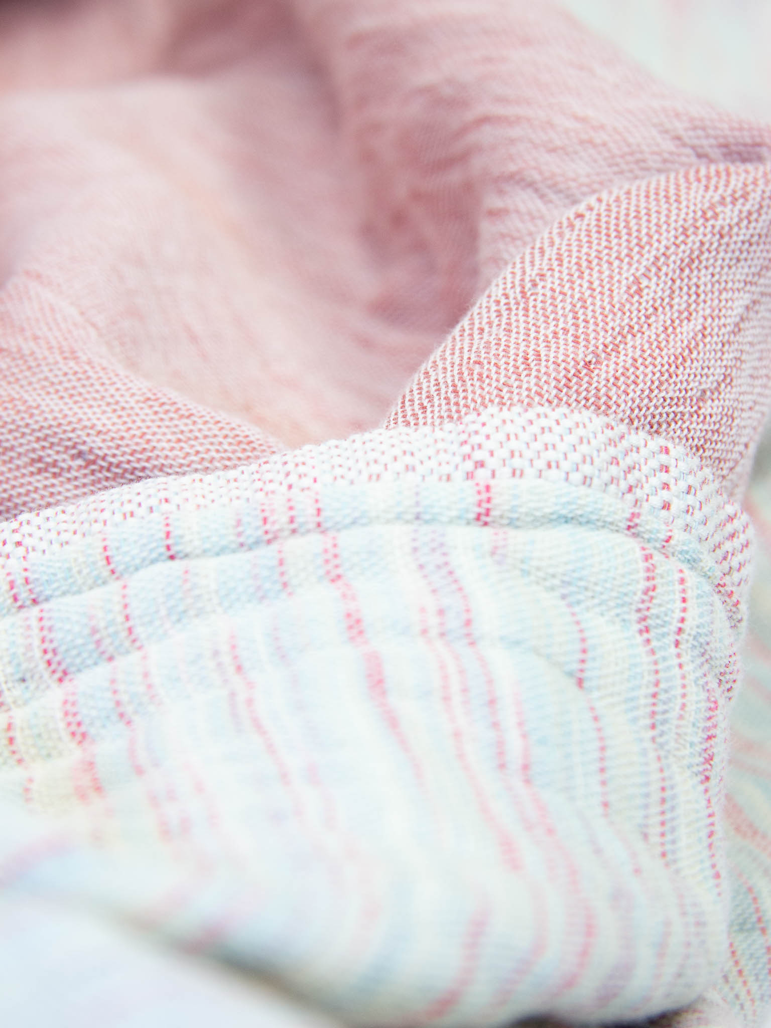 Pink patterned, double sided, beach towel close up