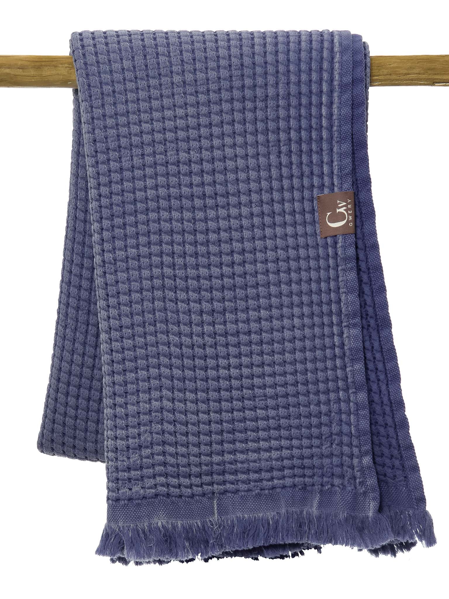 Blue double sided, honeycomb beach towel folded