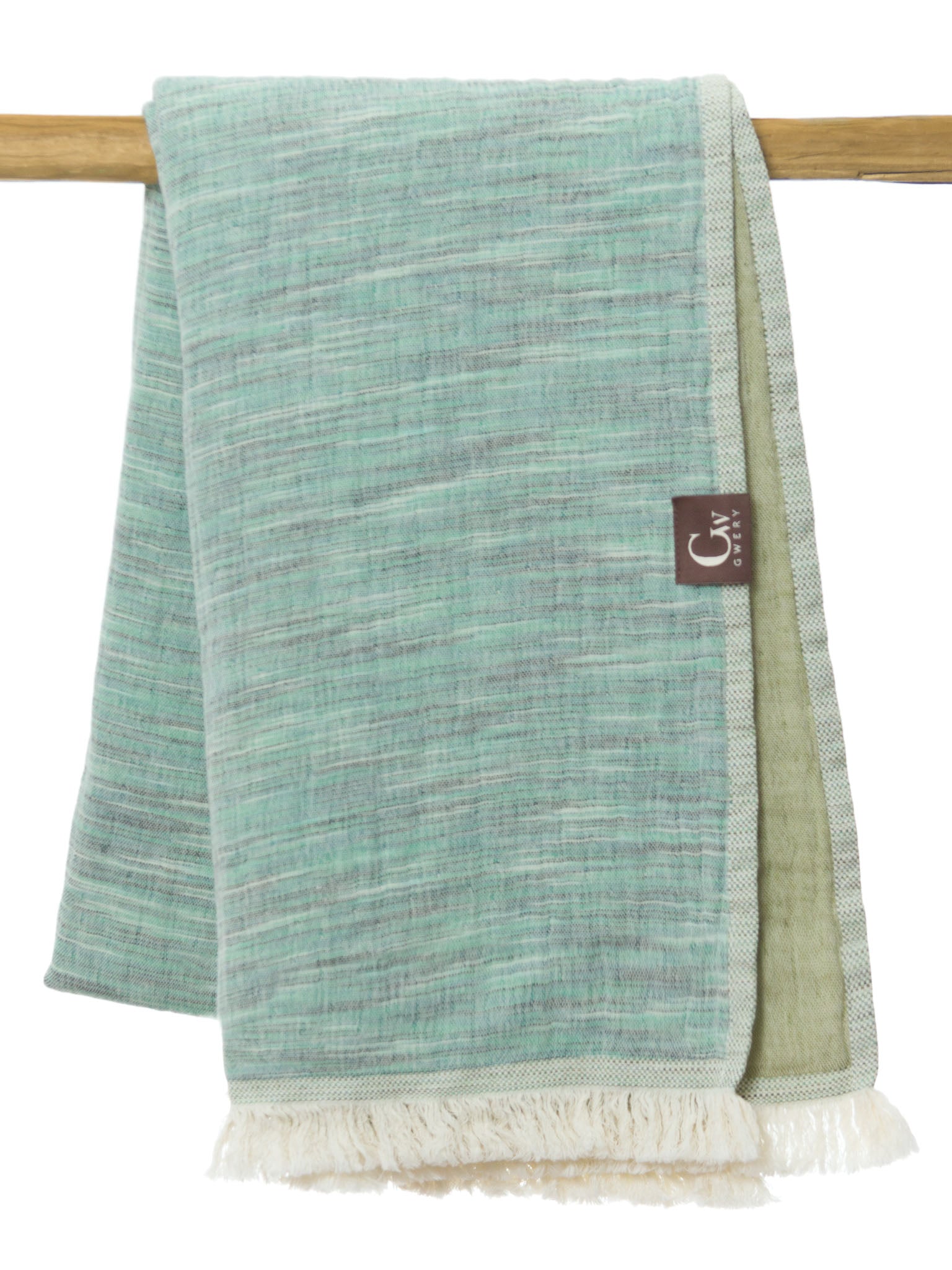 Green patterned, double sided, beach towel folded