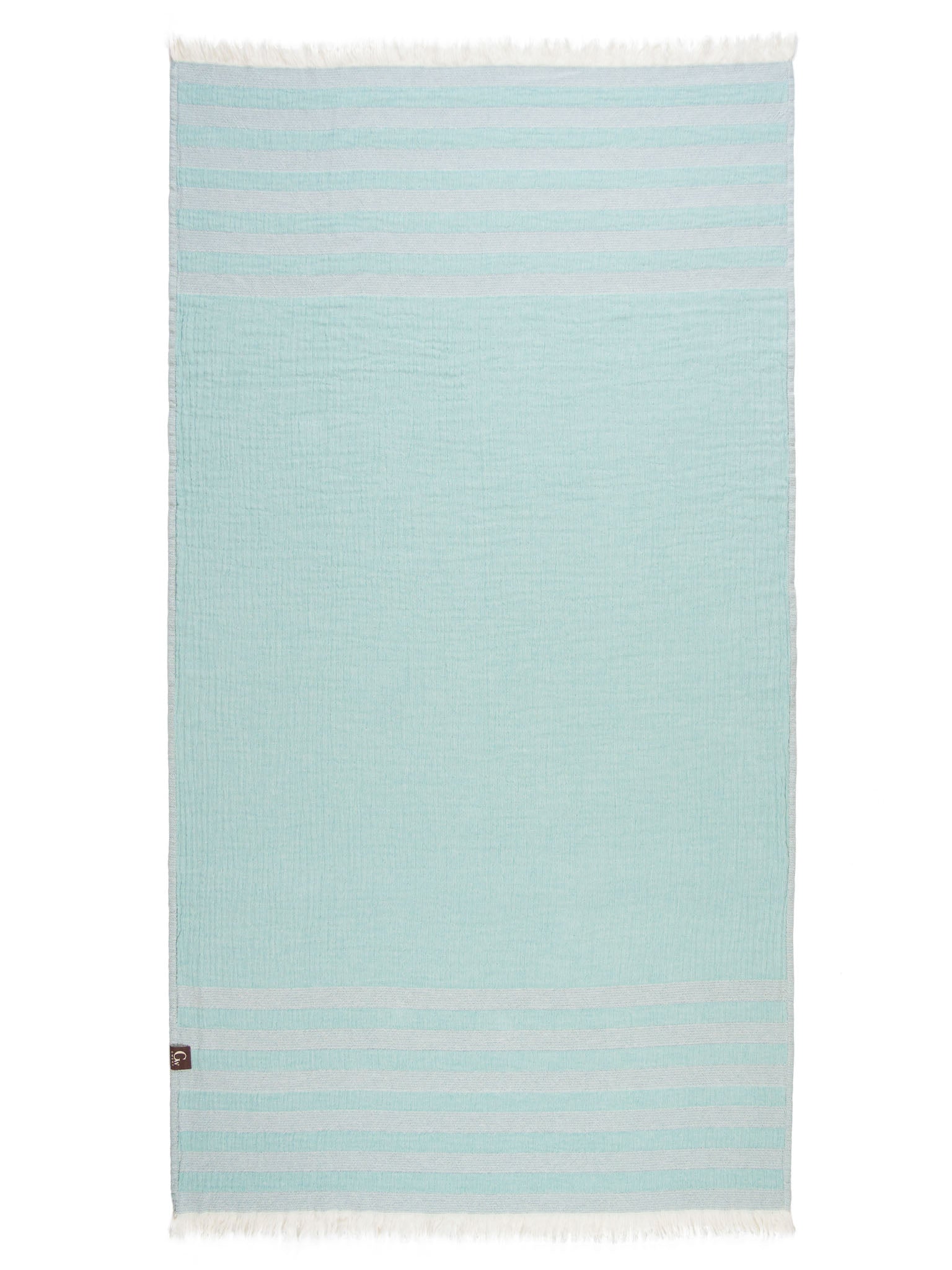 Light and dark green striped beach towel open up showing light green side