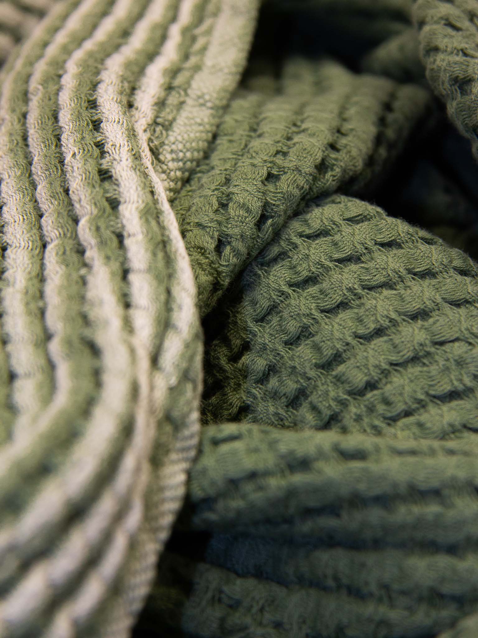 Green double sided, honeycomb beach towel close up