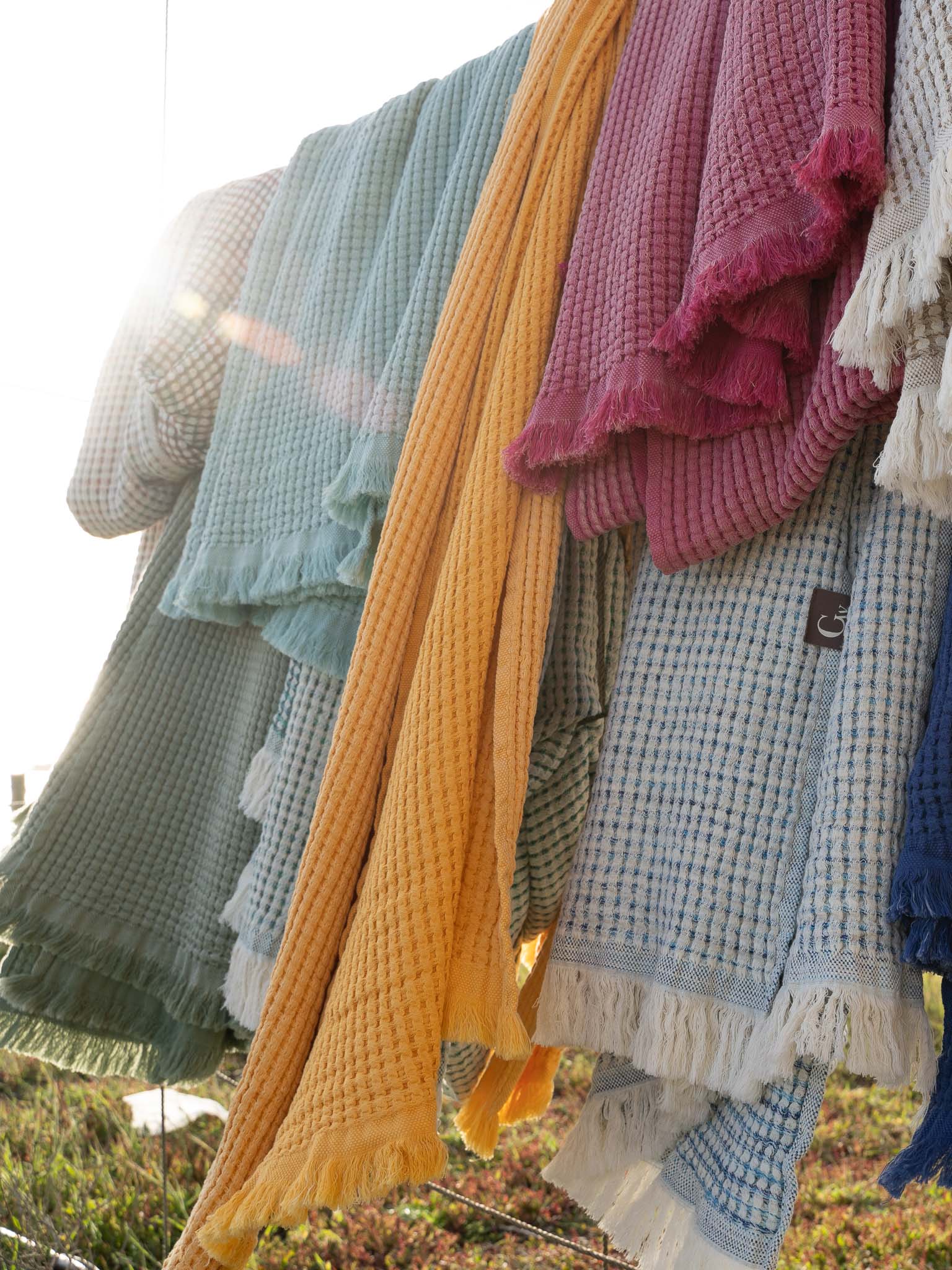 gwery honeycomb beach towels hanging  on a beach