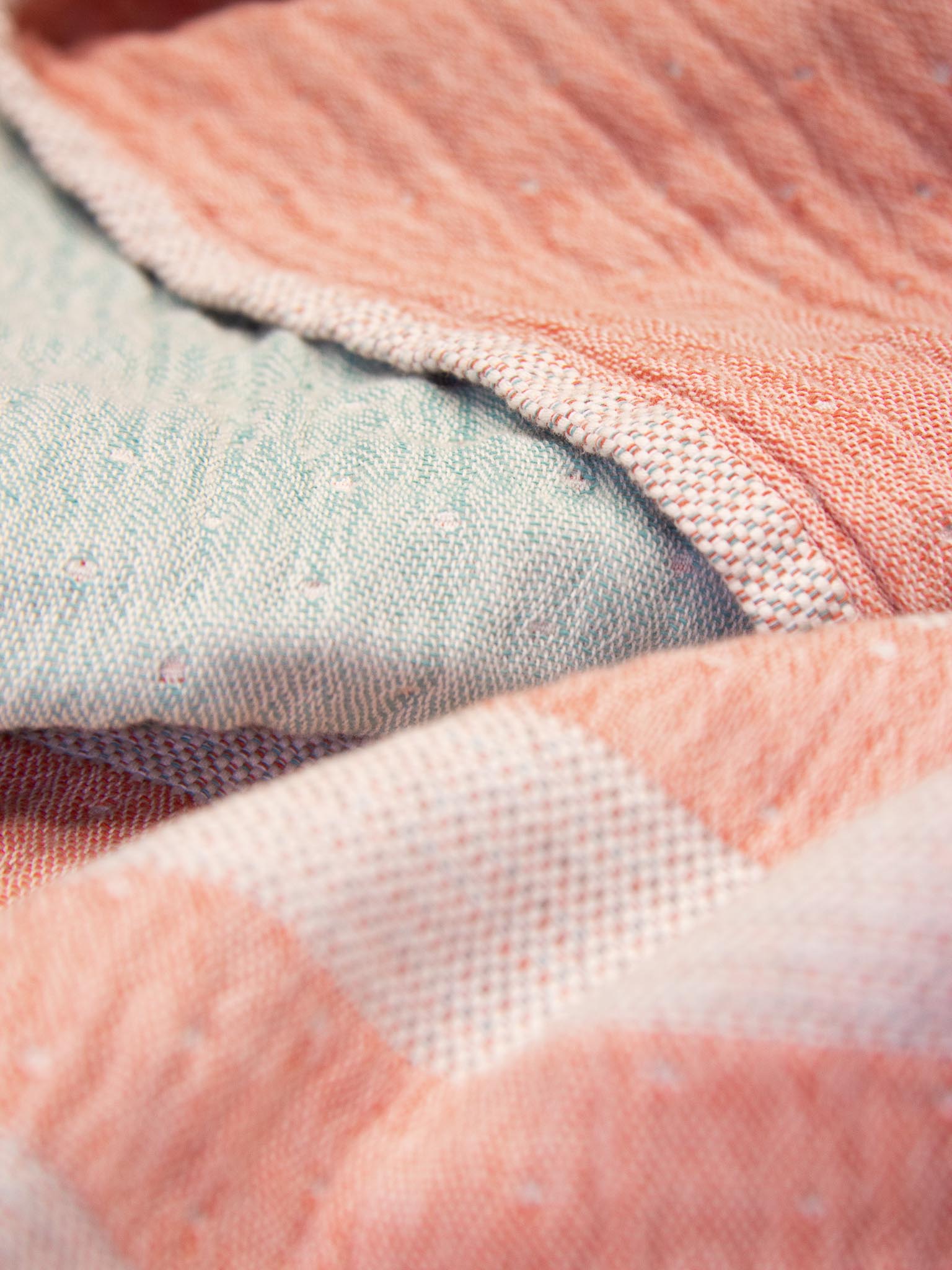 Orange and green double sided striped beach close up