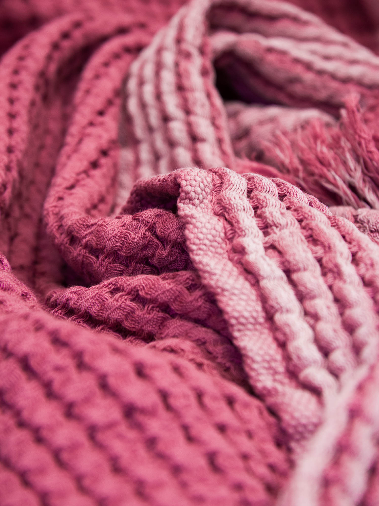Pink double sided, honeycomb beach towel close up