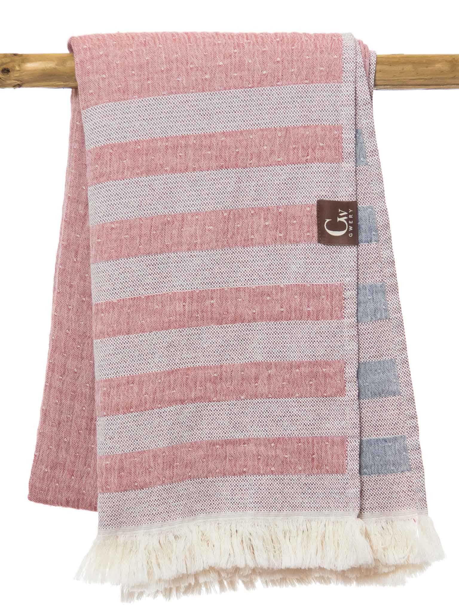 Red and blue double sided striped beach towel folded