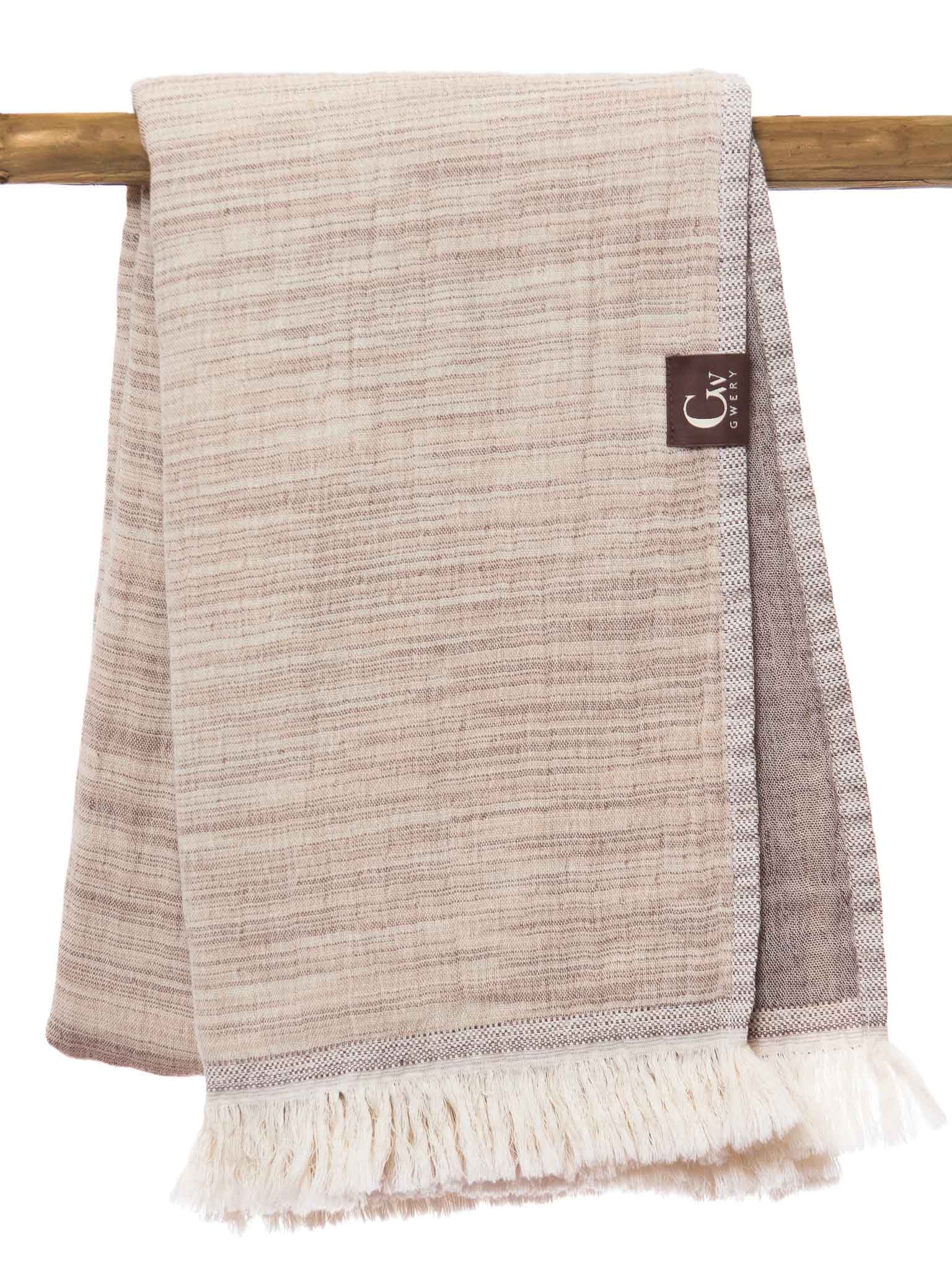 Brown patterned, double sided, beach towel folded