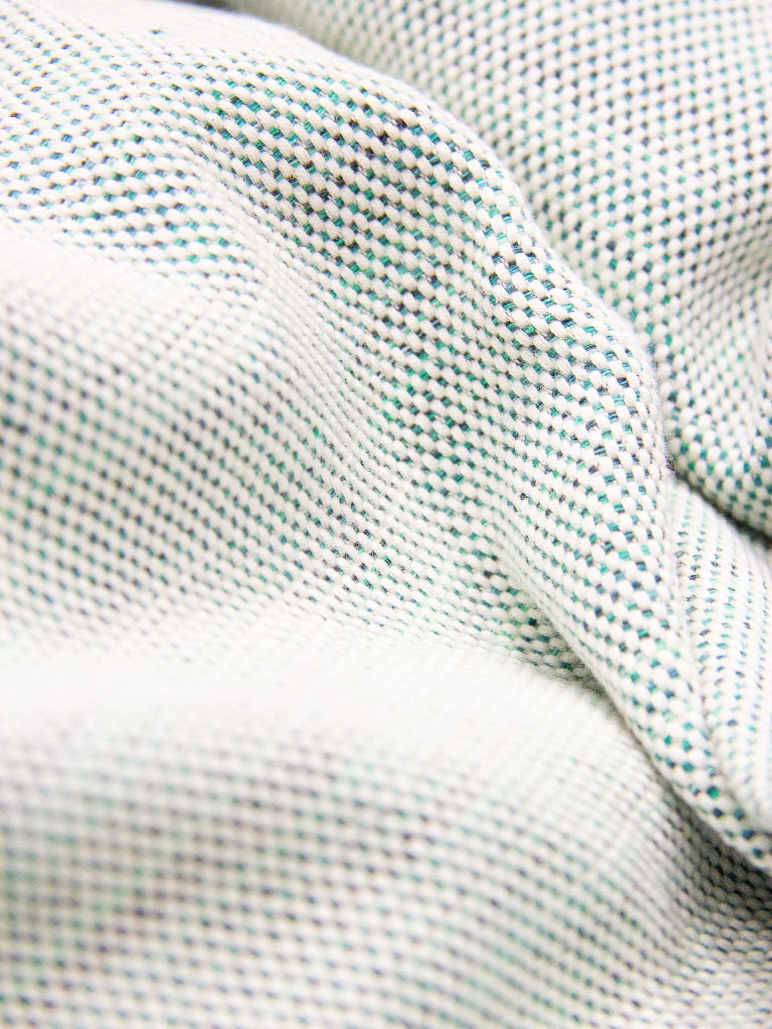 Green patterned lightweight beach towel close up