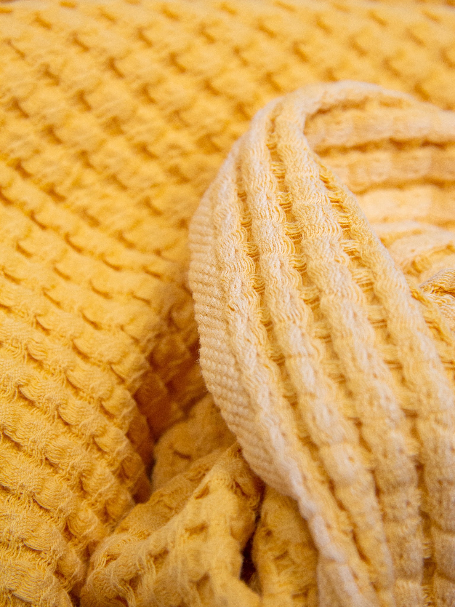 Yellow double sided honeycomb beach towel close up