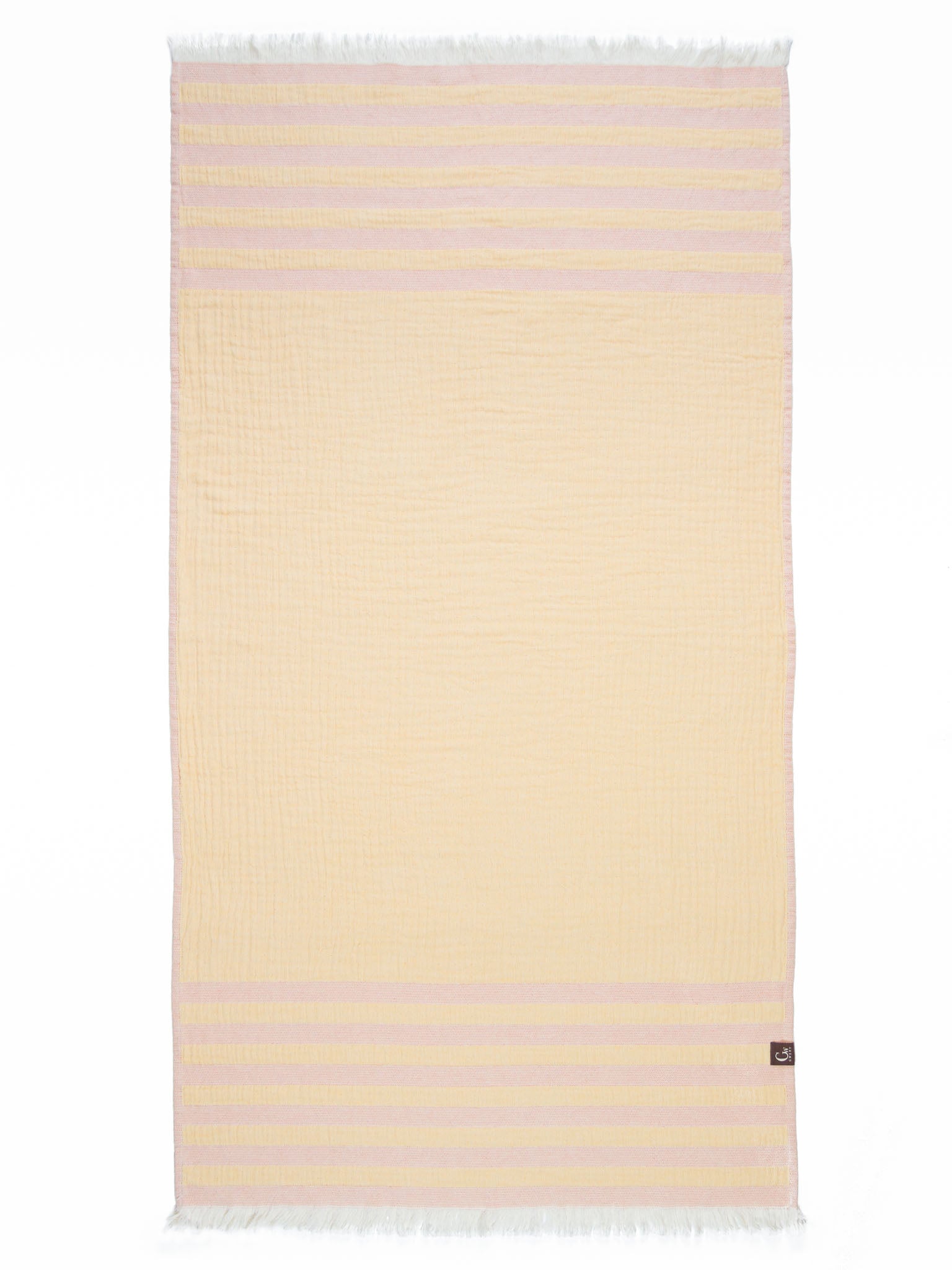 Yellow and orange striped beach towel open up