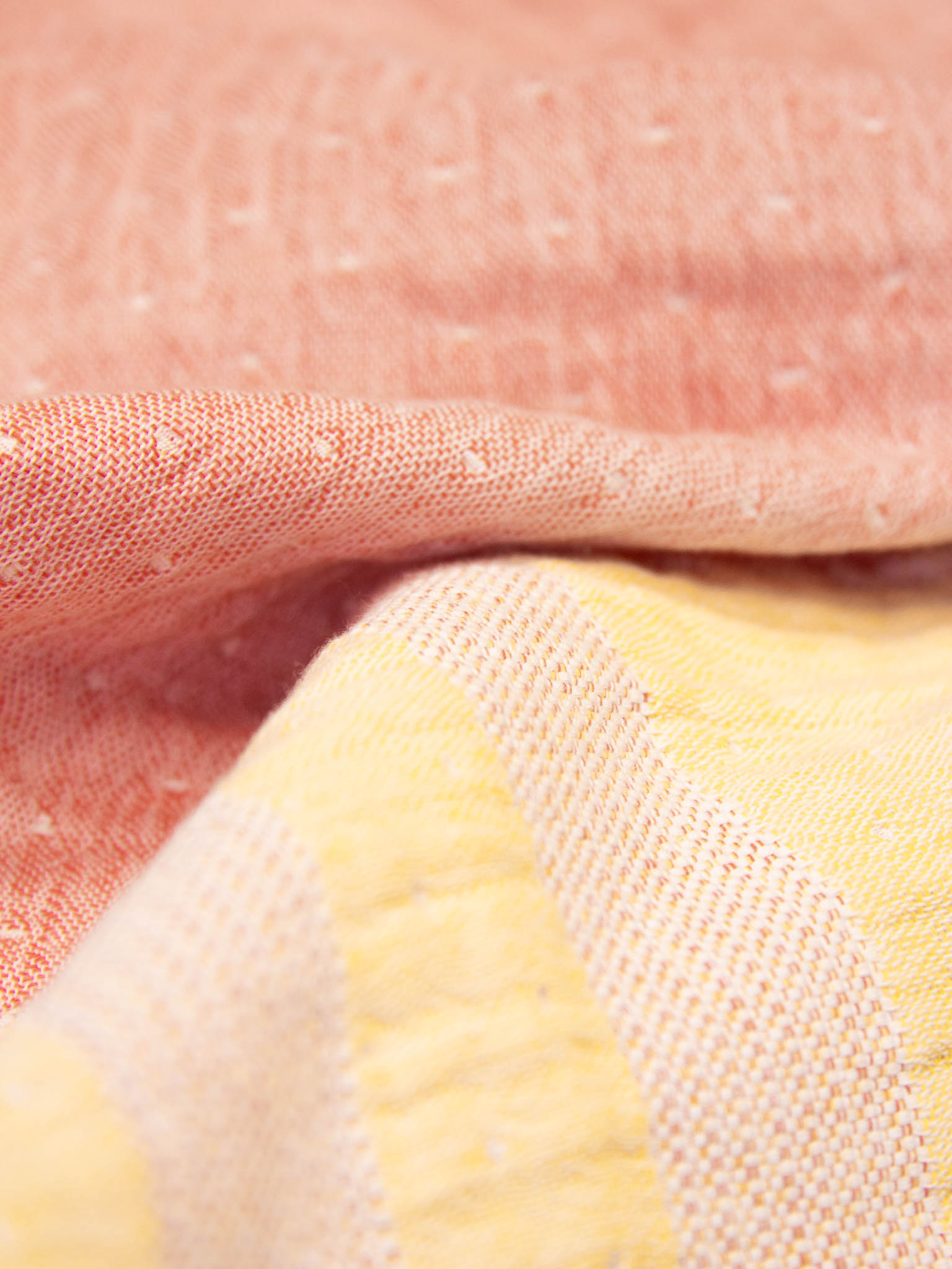 Yellow and orange striped beach towel close up